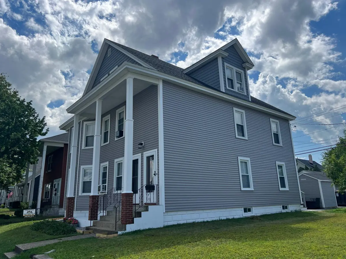 Vinyl Siding Replacement in Manchester, NH — finished by Maia Construction