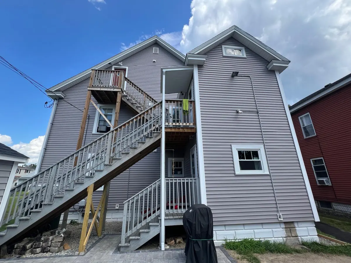 Vinyl Siding Replacement in Manchester, NH — finished by Maia Construction