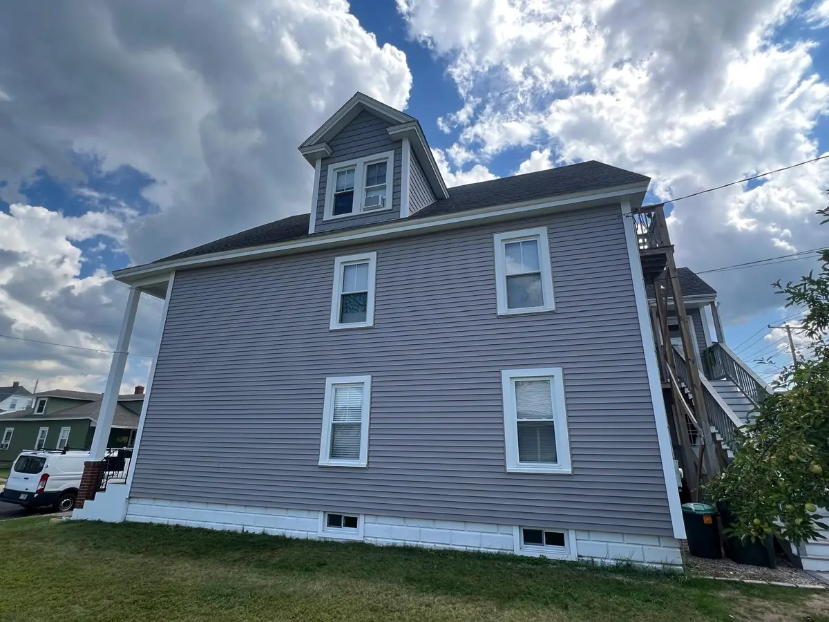 Vinyl Siding Replacement in Manchester, NH — finished by Maia Construction