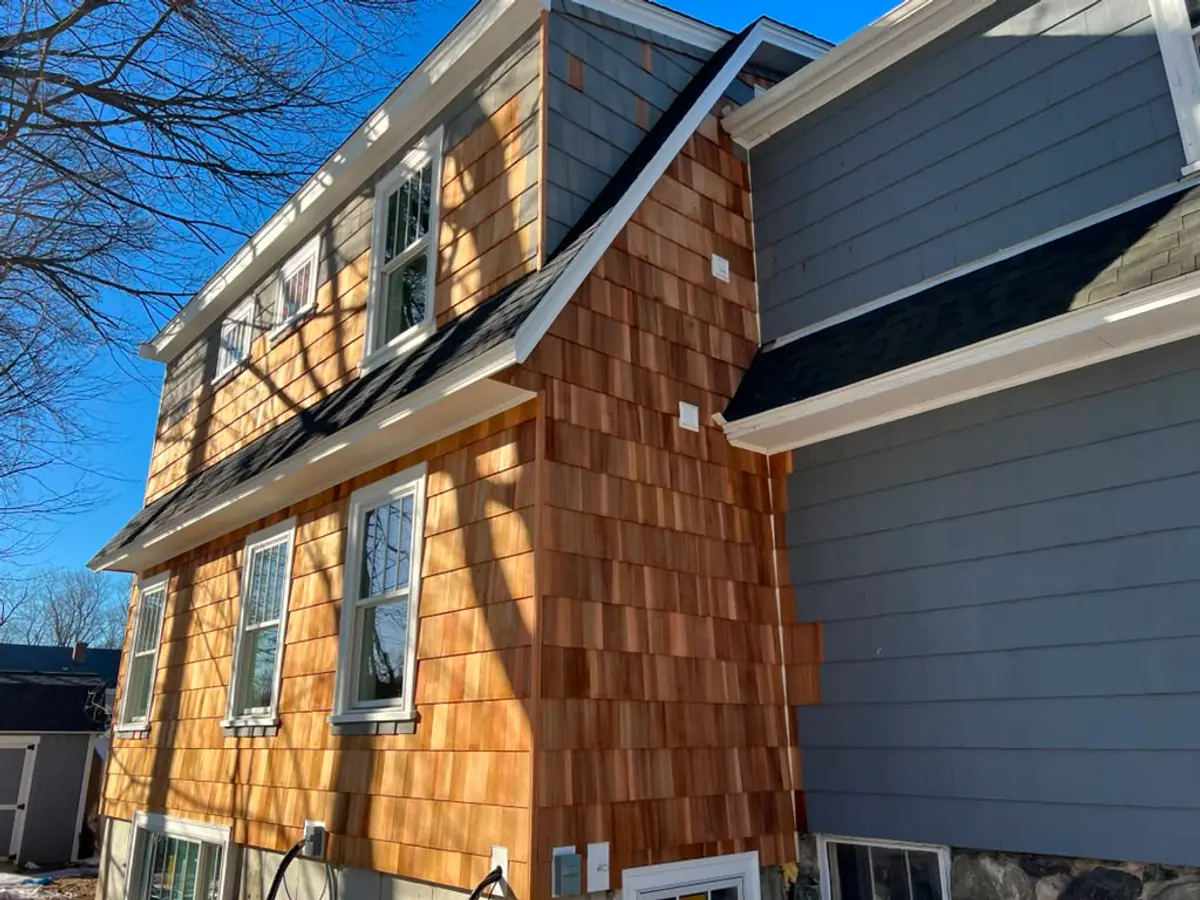 Cedar shingle siding and white trim on a Reading, MA addition