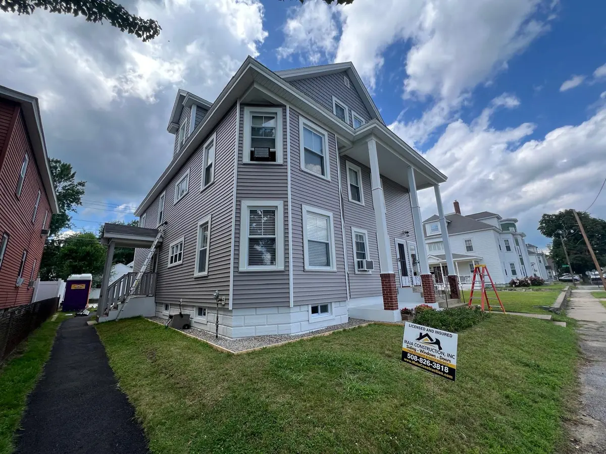 Completed siding job in Manchester, NH seen from the pavement