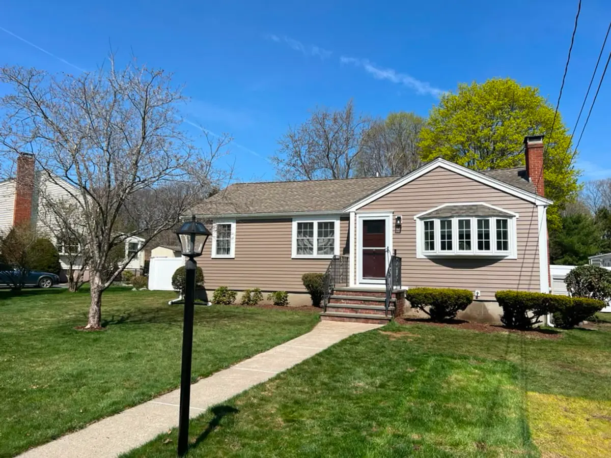 Street view of a completed siding and window project in Woburn, MA
