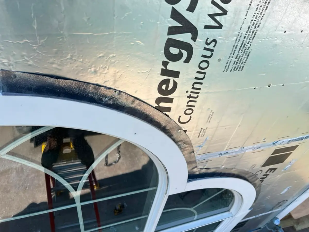 Close detail of custom PVC arch trim over EnergyShield insulation in Woburn, MA